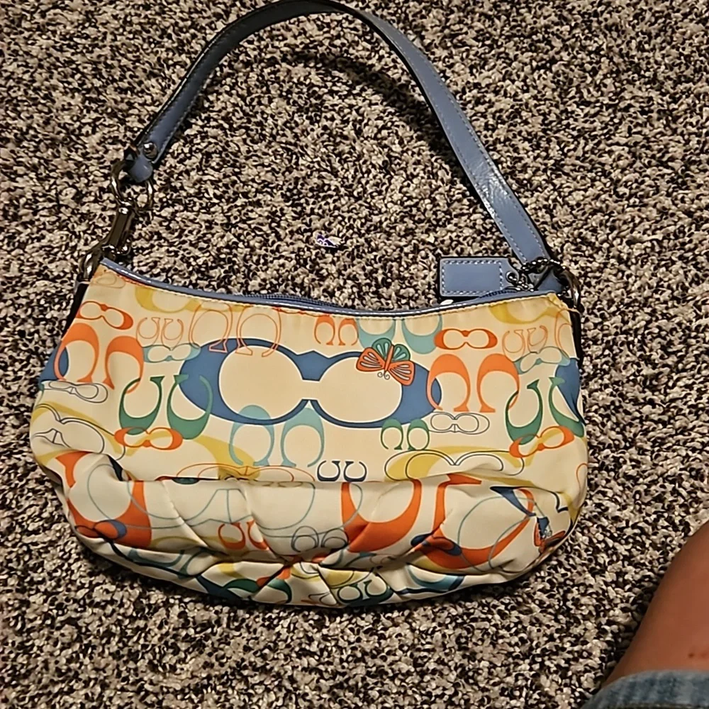 Vintage Coach bag. White small purse with the Coach Cs on it and butterflies
